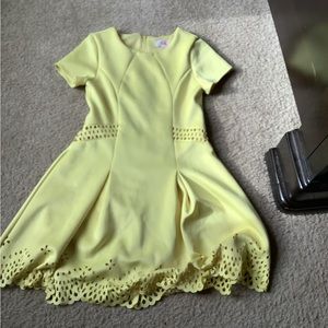 This is a GB girls yellow formal dress with designs